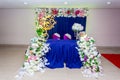 Artificial colorful paper flowers with navy-blue color based wedding stage Royalty Free Stock Photo
