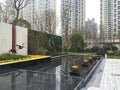 an artificial courtyard with water features of various species and plants