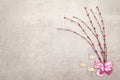 Artificial decorative willow twigs and wooden figures of bunny. The concept of Easter cards, wallpapers, stone background. Top