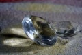 Artificial diamonds lying in the sand photographed in the studio with flash light Royalty Free Stock Photo
