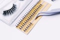Artificial false fluffy eyelashes with tweezers Royalty Free Stock Photo