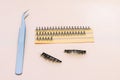 Artificial false fluffy eyelashes with tweezers. Royalty Free Stock Photo