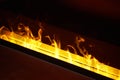 Artificial fireplace. Burning logs. Decorative fire Royalty Free Stock Photo