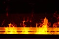 Artificial fireplace. Burning logs. Decorative fire Royalty Free Stock Photo