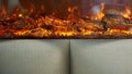 Artificial fireplace. Burning logs. Decorative fire Royalty Free Stock Photo