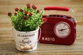 Artificial Flower, Red Vintage Radio on Wooden Background Royalty Free Stock Photo