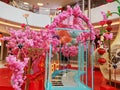 Artificial flowers decorate the landscape, in the mall lobby