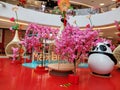 Artificial flowers decorate the landscape, in the mall lobby