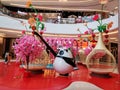 Artificial flowers decorate the landscape, in the mall lobby