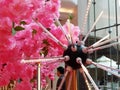 Artificial flowers decorate the landscape, in the mall lobby