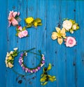 Artificial flowers on a wooden board Royalty Free Stock Photo