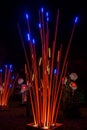 Artificial giant bamboo plants and flowers decorated with lights Royalty Free Stock Photo