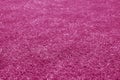 Artificial grass football field loan with blur effect in pink tone Royalty Free Stock Photo