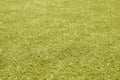 Artificial grass football field loan with blur effect in yellow tone Royalty Free Stock Photo