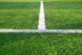 Artificial grass of football field with white stripe, Soccer corner line detail Royalty Free Stock Photo