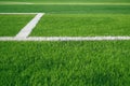 Artificial grass of football field with white stripe, Soccer corner line detail Royalty Free Stock Photo