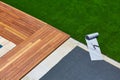 Artificial grass installation in deck garden with tools