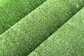 Artificial grass lawn texture. Artificial Turf Background. Greening with an artificial grass. Rolled artificial turf laying backgr Royalty Free Stock Photo
