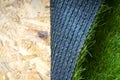 Artificial grass roll on the osb subfloor Royalty Free Stock Photo