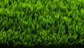 Artificial grass texture background of synthetic green lawn surface for design and decoration use Royalty Free Stock Photo