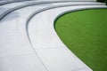 Artificial green grass with white concrete stairs for nature theme  decoration concept Royalty Free Stock Photo