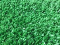 Artificial green turf background, selective focus Royalty Free Stock Photo