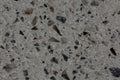 Artificial grey stone quartz agglomerate gloss texture.