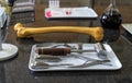 Artificial human femur and surgical tools set on laboratory worktop