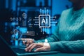 Artificial intelligence concept. Person using laptop with digital interface icons and AI processor representing machine learning, Royalty Free Stock Photo
