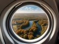 image of the aeroplane window viewing the beautiful outside aerial landscape.