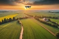 image of flying drone above the farmland field.