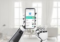 Artificial intelligence for health management concept. Robot hand holds a mobile phone with a health app