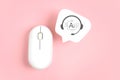 Artificial Intelligence icon inside headphone on real white speech bubble paper cut with wireless computer mouse on pink Royalty Free Stock Photo