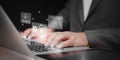 Artificial intelligence technology concept with businessman typing on laptop and virtual AGI icons, cloud computing, cybersecurity Royalty Free Stock Photo