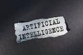 ARTIFICIAL INTELLIGENCE - text on torn paper on dark desk in sunlight Royalty Free Stock Photo