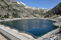 Artificial lake with a dam in the mountains Royalty Free Stock Photo