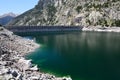 Artificial lake with a dam in the mountains Royalty Free Stock Photo