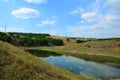 Artificial lake with a reduced water level.