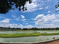 Photo of artificial lake, small forest path, big cloud at sky for background Royalty Free Stock Photo