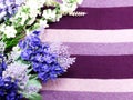 Artificial lavender flowers bouquet on fabric background Royalty Free Stock Photo