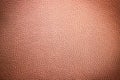 Artificial leather background with vignette. Beige surface texture Royalty Free Stock Photo