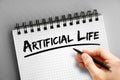 Artificial life text on notepad, concept background Royalty Free Stock Photo