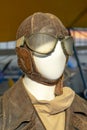 artificial mannequin bust of an aviator pilot with characteristic equipment from the beginning of aviation