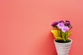 Artificial pink and purple rose bouquet in white flower pot on p Royalty Free Stock Photo