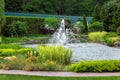 An artificial pond with a fountain in the water. Royalty Free Stock Photo