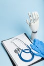 Artificial robotic prosthesis. Doctor holds cyber hand Royalty Free Stock Photo