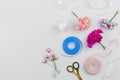 artificial roses scissor with blue pink ribbon white background. High quality photo Royalty Free Stock Photo