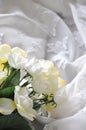 Artificial Roses on White Chiffon Fabric Royalty Free Stock Photo