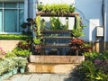 Artificial small vertical waterfall for decorated garden Royalty Free Stock Photo