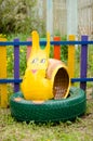 Artificial snail made of tires - decoration on the playground Royalty Free Stock Photo